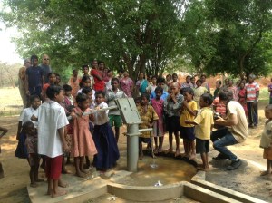 Hal & Jamie & kids around new well ... 