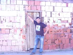 Man In Front Of Home - Serbia