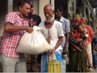 Refugee man receiving essentials